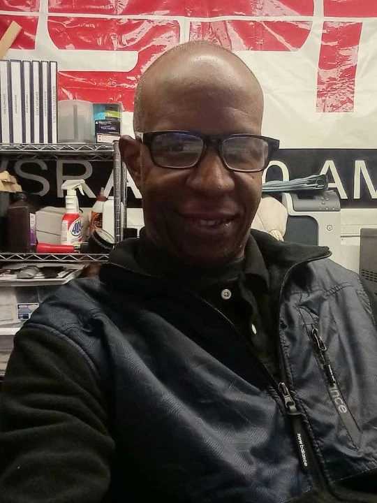 TCB wearing headphones in the radio studio