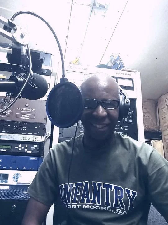 TCB in an Infantry shirt at the microphone